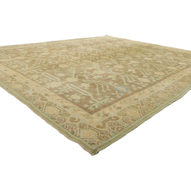 51627 Earth-Tone Turkish Khotan Rug 08’02 x 09’09. Emanating timeless style with incredible detail and texture, this hand...