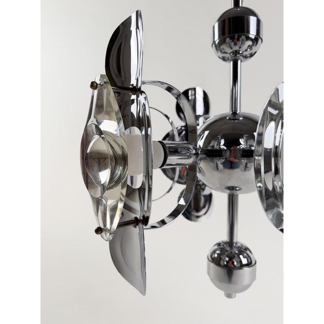 We are delighted to offer for sale this exceptional 6-light Space Age chandelier, designed by celebrated Italian designer...