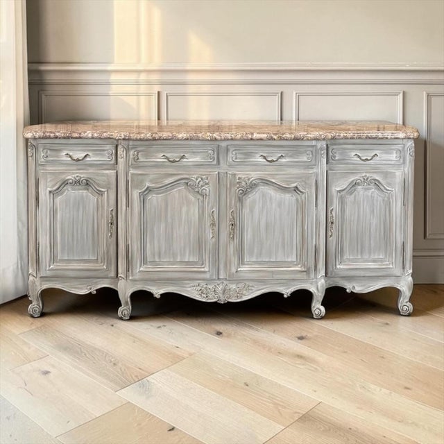 Commanding in scale and graceful in movement, this Country French buffet draws upon the provincial cabinetmaking...