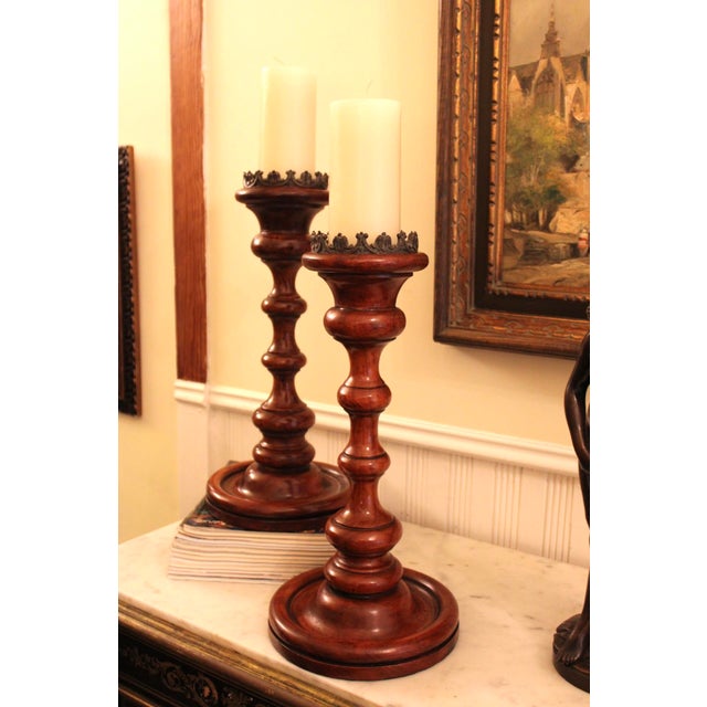 Gorgeous pair of turned wood candlesticks by luxury brand Theodore Alexander. These are in excellent condition and stand...