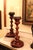 Gorgeous pair of turned wood candlesticks by luxury brand Theodore Alexander. These are in excellent condition and stand...