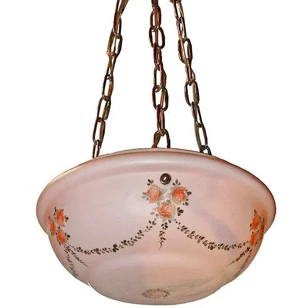 Mid century vintage bowl form hanging fixture having milk glass shade with painted floral and garland motif.