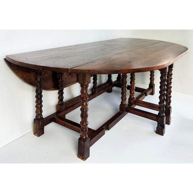 English Early 20th Century Oval Wood Gate-Leg Drop-Leaf Dining Room Table With Turned Legs, Seats 8 For Sale - Image 3 of 12
