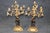 This magnificent French three-piece bronze and ormolu clock garniture, crafted during the late nineteenth century, is a...