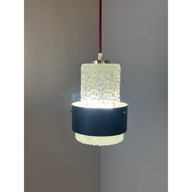 This rare pendant lamp by carl fagerlund for orrefors combines typical scandinavian elegance with the distinctive design...