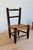 Adorable dark wood children's chair with a hand-woven straw seat. Its rustic and authentic look makes it a lovely...