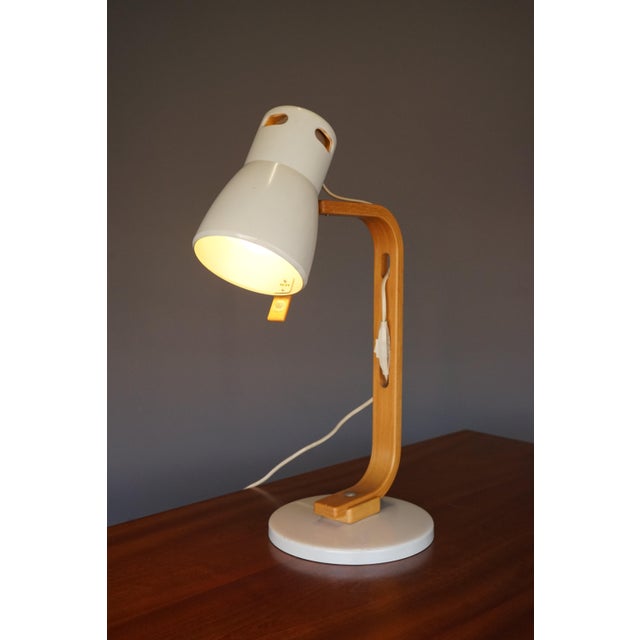 A superb quality practical desk or table lamp. Marked both to the underside of the base and to the shade. The angle of the...