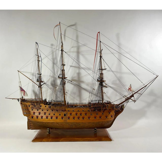Plank on frame model of the famous English warship HMS Victory. This model is planked in varnished walnut above the...
