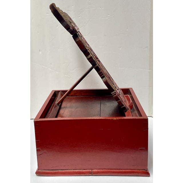 A handsome piece to add to a bookshelf or hold a mirror on a vanity. It is hand-carved with good luck and long life...