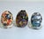 A cheerful vintage decorative trio pairing a signed 1996 Laurel Burch “Flowering Feline” ceramic cat with two Japanese...
