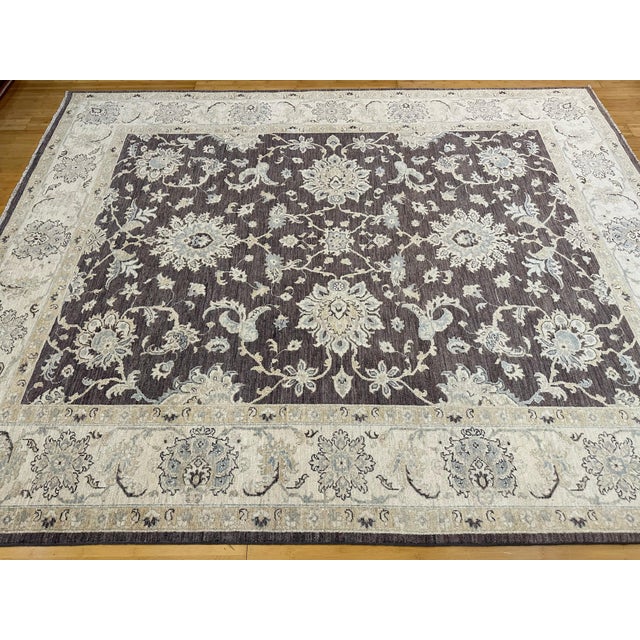 This is a Pakistani Ziegler Oushak-style rug, featuring a deep espresso-brown field with elegant ivory floral and vine...