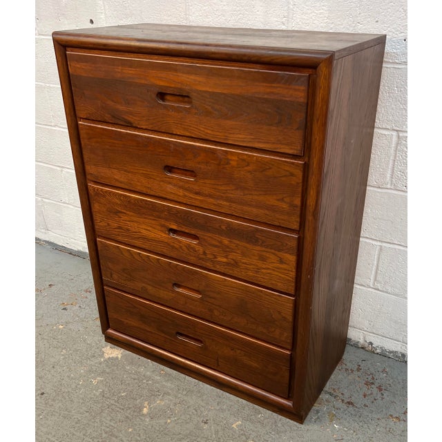 Mid-Century Modern five drawer dresser manufactured by Dixie. Crafted from richly grained oak, this vintage piece...