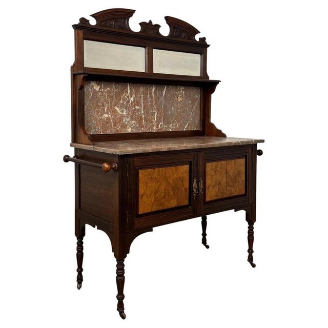 A beautifully crafted early 20th-century English Edwardian washstand, finely constructed in walnut and distinguished by...