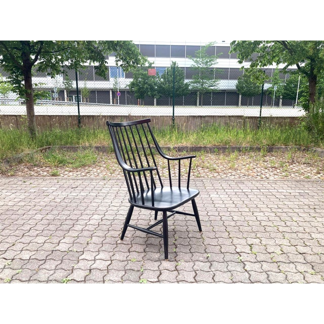Elegant Grandessa armchair designed by Lena Larsson for Nesto, Sweden. Crafted from black-lacquered birch with the model's...