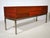 Mid-century modern audio lowboard/sideboard from the 1960s with a wooden cabinet and metal frame. The elongated body...