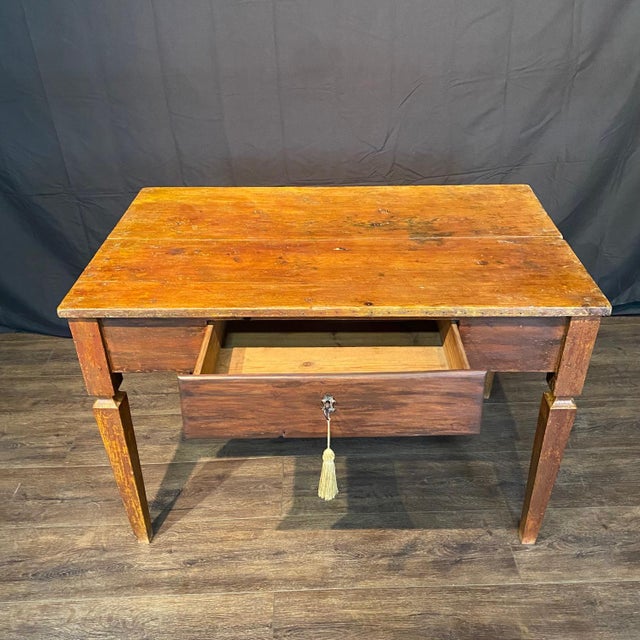 Antique French writing table from Provence, France with single deep drawer retaining its working lock and key. Elegant...