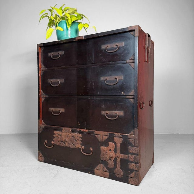 This antique Japanese tansu is a chōba-dansu (merchant’s chest) from the Meiji period, dating to around 1900–1910....
