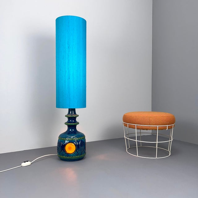 Rare ceramic lamp with illuminated base. Shade and base can be switched on and off separately. This piece has an...