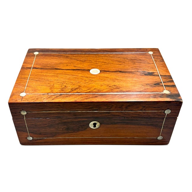 A gorgeous antique English rosewood & mother of pearl inlay box, circa 1890. It is made of rosewood and is decorated with...