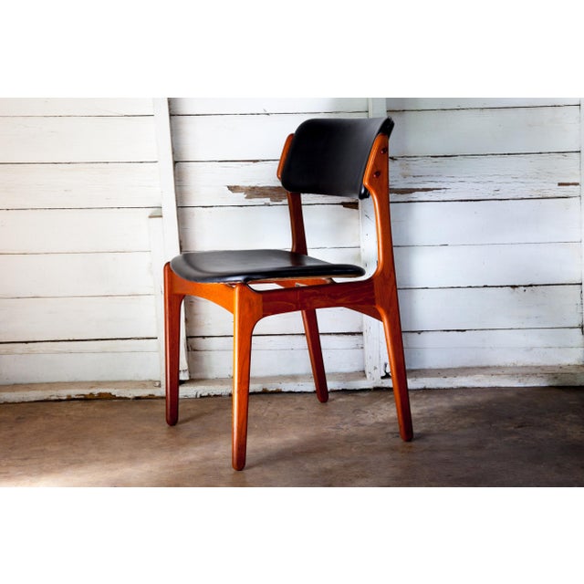 A Mid-Century Modern icon, the vintage Model 49 Side Chair by Erik Buch in rosewood manufactured by Oddense Maskinsnedkeri...