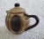 A Sgrafo Modern stoneware teapot that was made in Germany during the 1960s. Such an incredible piece. Measuring 9” w x 5...