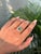 This striking 1.06 carat emerald-cut emerald and diamond split-shank ring is crafted in 14K yellow gold. The emerald...