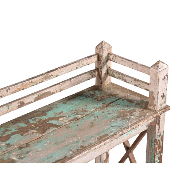 This Vintage Indian Teakwood Shelf or Small Bookcase is constructed from solid teakwood, featuring three open shelves...