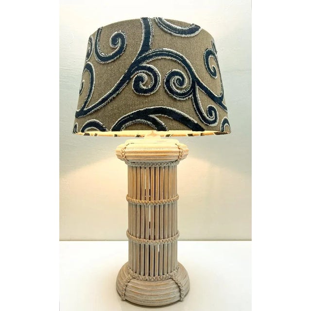 Beautiful large Mid Century Pencil Reed and Rattan table lamp. Expertly crafted in Bamboo wood and subtly detailed with...