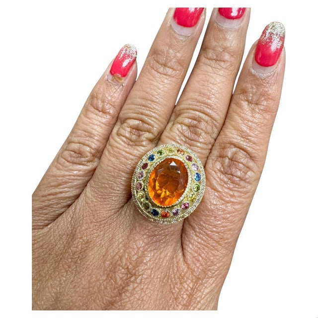5.14 Carat Natural Fire Opal Sapphire and Diamond Yellow Gold Cocktail Ring This ring has a beautiful 3.17 Carat Oval Cut...