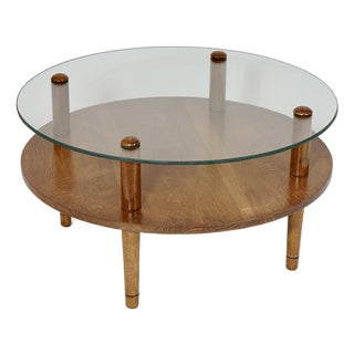 Mid Century Modern Round Double Tier Glass Walnut Coffee Table in the Style of Gilbert Rohde For Sale