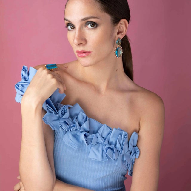 The Monica Earrings, crafted from semi-precious stones, showcase a unique shape and offer a removable drop, allowing for a...