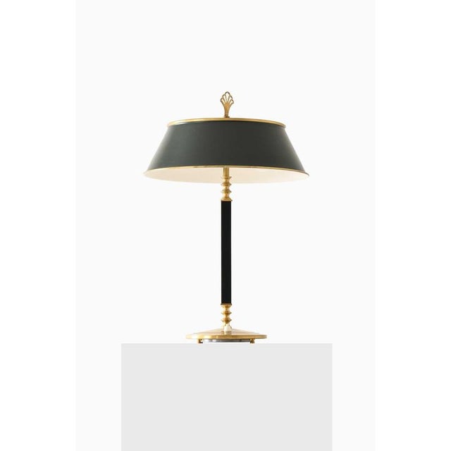 The very rare table lamp, model 6942, designed by Arvid Böhlmark and produced by Arvid Böhlmarks Lampfabrik in Sweden, is...