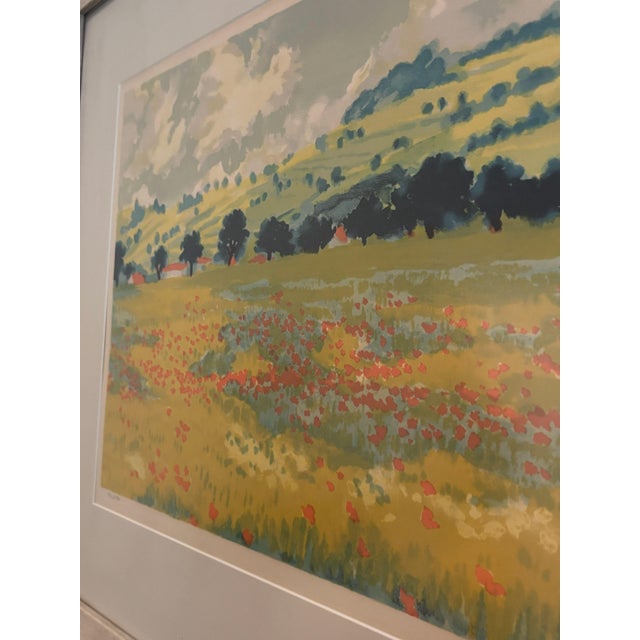 Limited-edition mid-to-late 20th-century landscape print. Features a colorful pastoral field of poppies and rolling hills...
