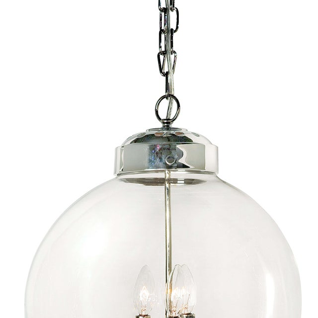 Circular glass globe pairs with three candle styled cluster to lend sculptural, contemporary style. Its clean lines and...