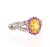 This ring has a 1.28 Carat Oval Cut Natural Yellow Sapphire. It has a halo of 17 Pink Sapphires that weigh 0.29 carats...