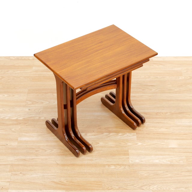 Mid-century set of nesting tables by G Plan. Constructed from teak and afromosia, these quality side tables are...
