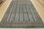 A tribal Bokhara rug hand-knotted with fine wool on a cotton foundation. This rug features rows of repeating medallions...