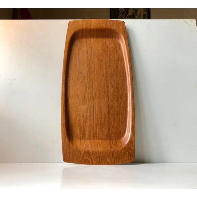 Large oblong serving tray made from teak veneer. Suitable as a bed serving tray due to its size and raised edges. It was...