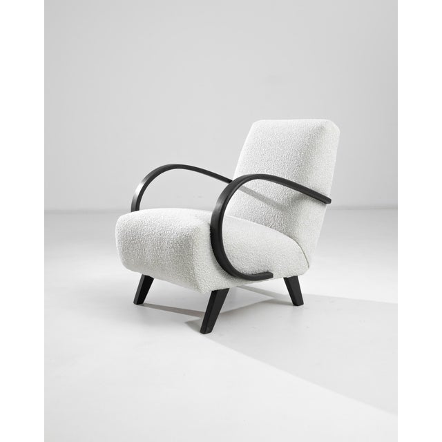 Introducing the 1950s Czech Wooden Armchair by J. Halabala, a timeless piece that combines vintage charm with modern...