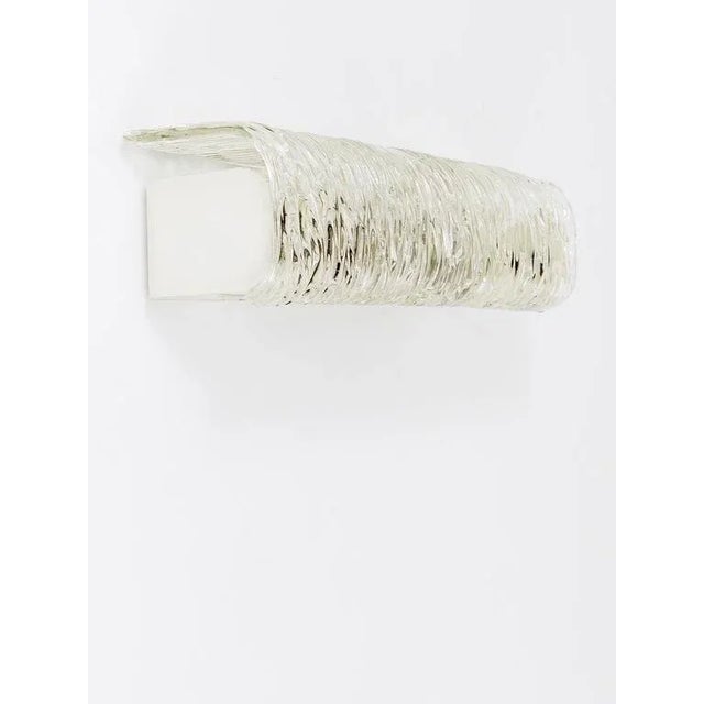 A beautiful brass and glass modernist sconce manufactured by kalmar, austria in the 1950s. To be used above a mirror, for...