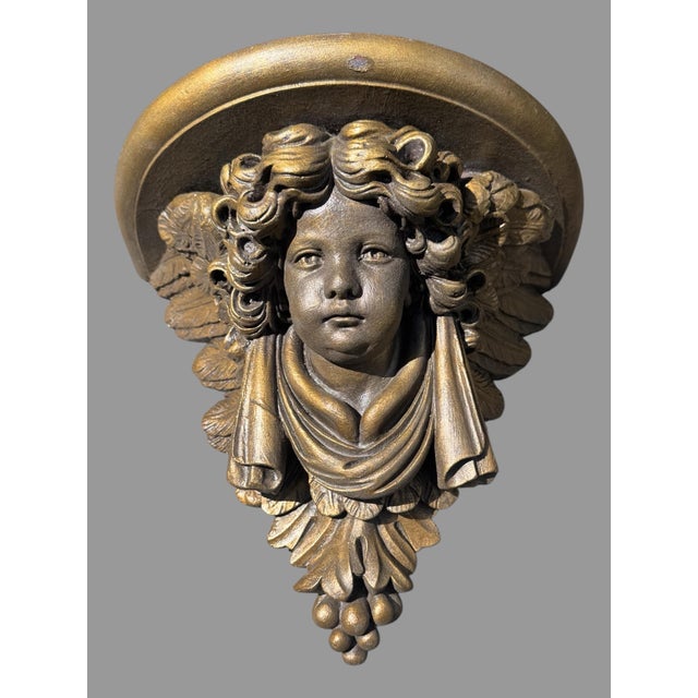 Pair Of Figural Cast Resin Hanging Wall Shelves with Winged Cupid Angel Heads In very nice original condition showing some...