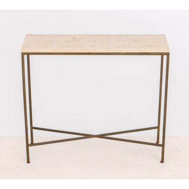 Paul McCobb Style Brass Console Table, with travertine top above brass frame with X-form stretcher. 31" H x 35" W x 11" D....