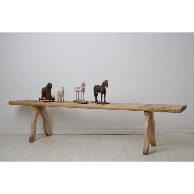 Antique folk art bench from Sweden made around 1820. The bench is made by hand in solid pine and has never been painted....