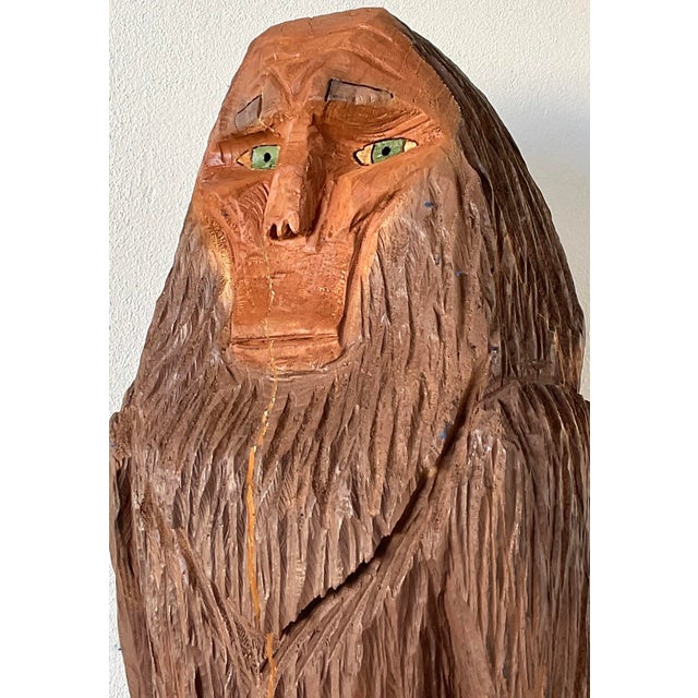 This large-scale hand-carved wooden Sasquatch sculpture is a masterwork of American folk art, bringing the legend of...