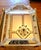 Ornaments from the 1920s. The beveled mirror frame features finely crafted floral glass ornaments and rosettes. True...