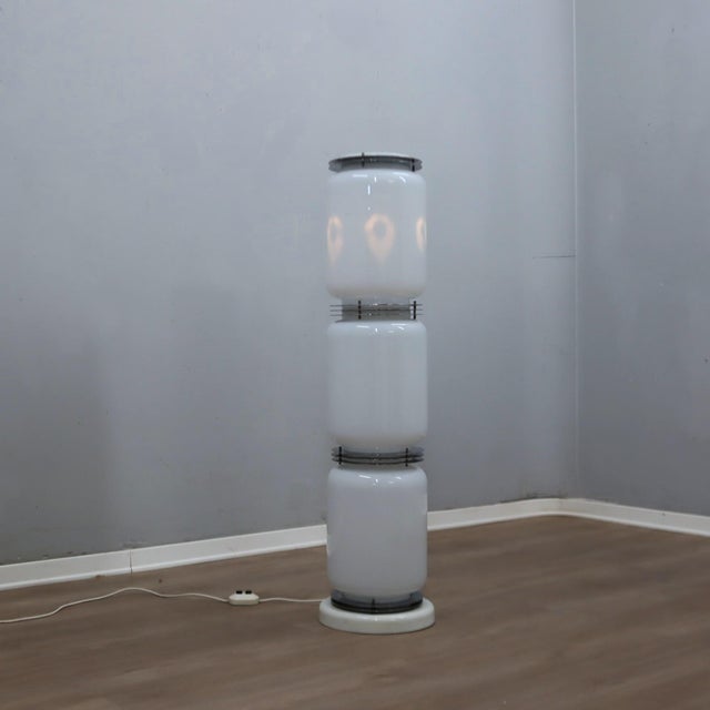 A magnificent statement piece of 1970s italian lighting design, this architectural "totem" floor lamp was produced by...