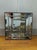 Here's a nice 1980s Art Deco style mirror in the style of LaBarge. The mirror is stepped and beveled. Framed in wood. Very...