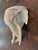 A near-pristine pair of vintage Italian white glazed ceramic elephant head wall brackets, beautifully sculpted with...