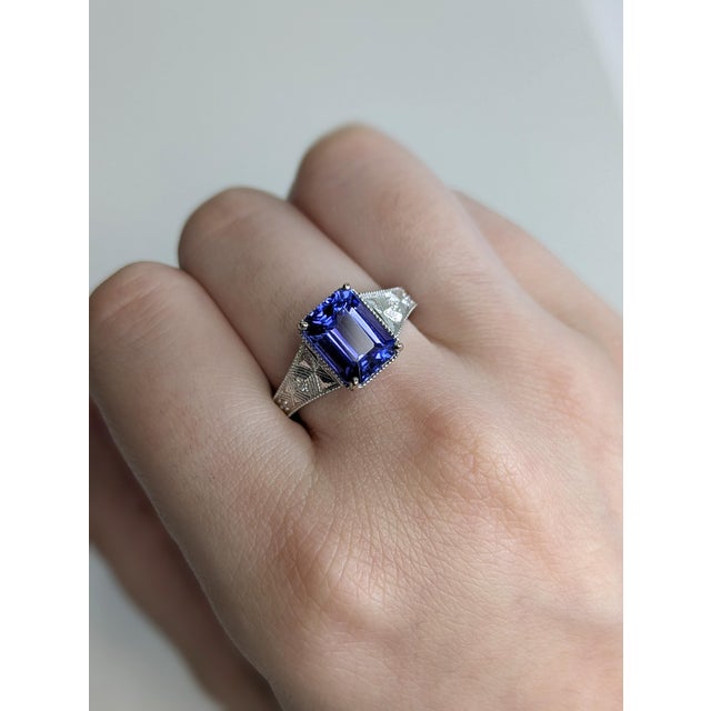 Make a statement with this 2.83ct Tanzanite ring in 14K white gold. Earth-mined diamonds add sparkle, while the broad,...