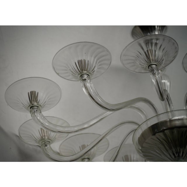 Splendid oval Murano glass chandelier. Note the classic shape in transparent Murano glass, very beautiful and unique. A...